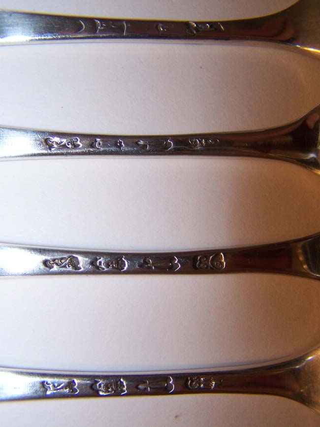A Fine and Rare Set of 12 English Silver Three-Prong Dessert Forks by Ebenezer Coker, London 1748, each with a 'Coronet' crest. — image 4